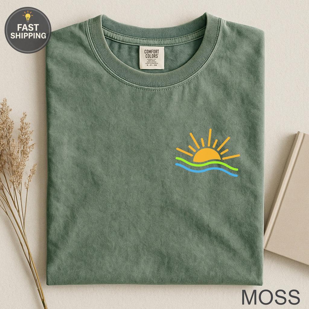 Moss green Comfort Colors t-shirt with sun and wave graphic.