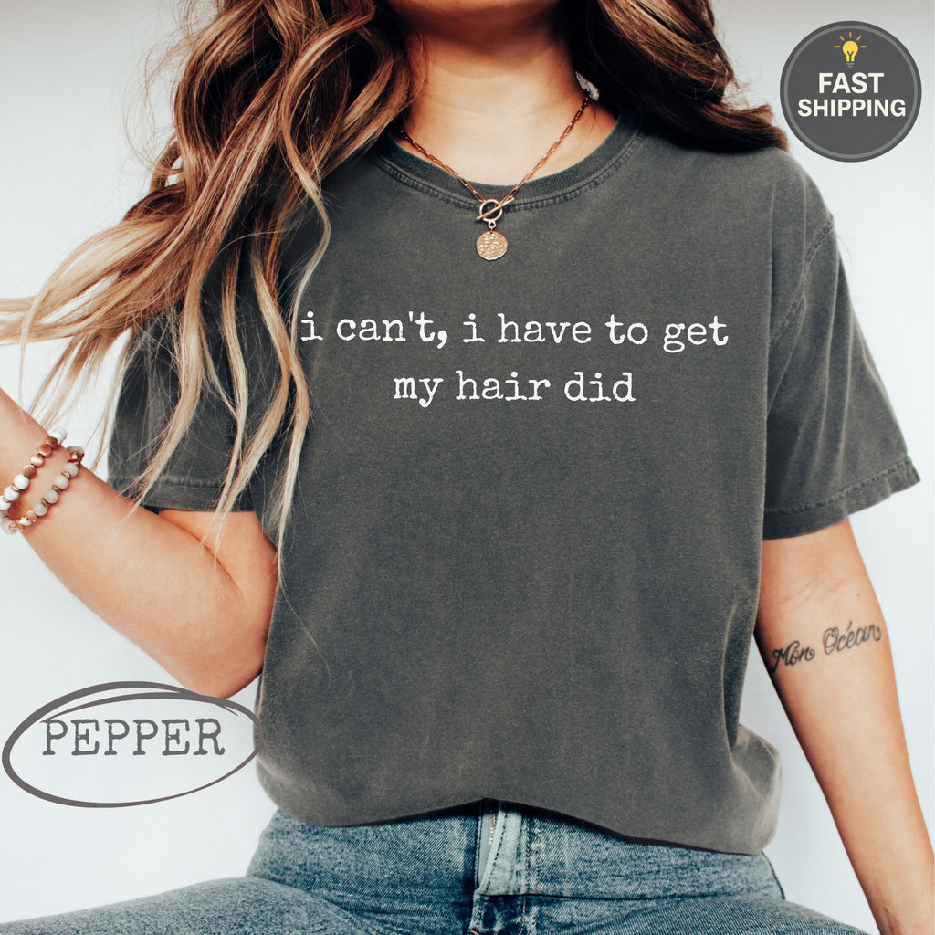 Dark grey t-shirt with "i can't, i have to get my hair did" text.