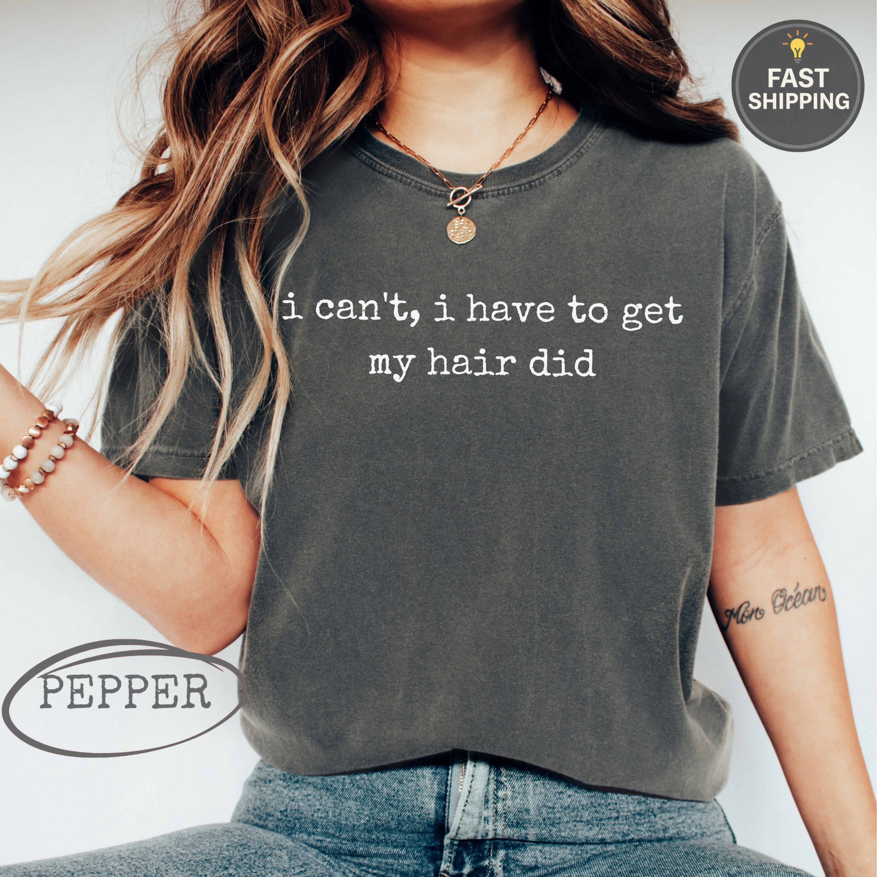 Dark grey t-shirt with "i can't, i have to get my hair did" text.