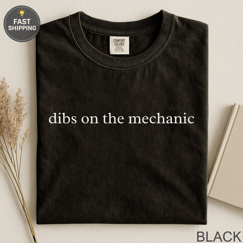 Black Comfort Colors t-shirt with "dibs on the mechanic" graphic.
