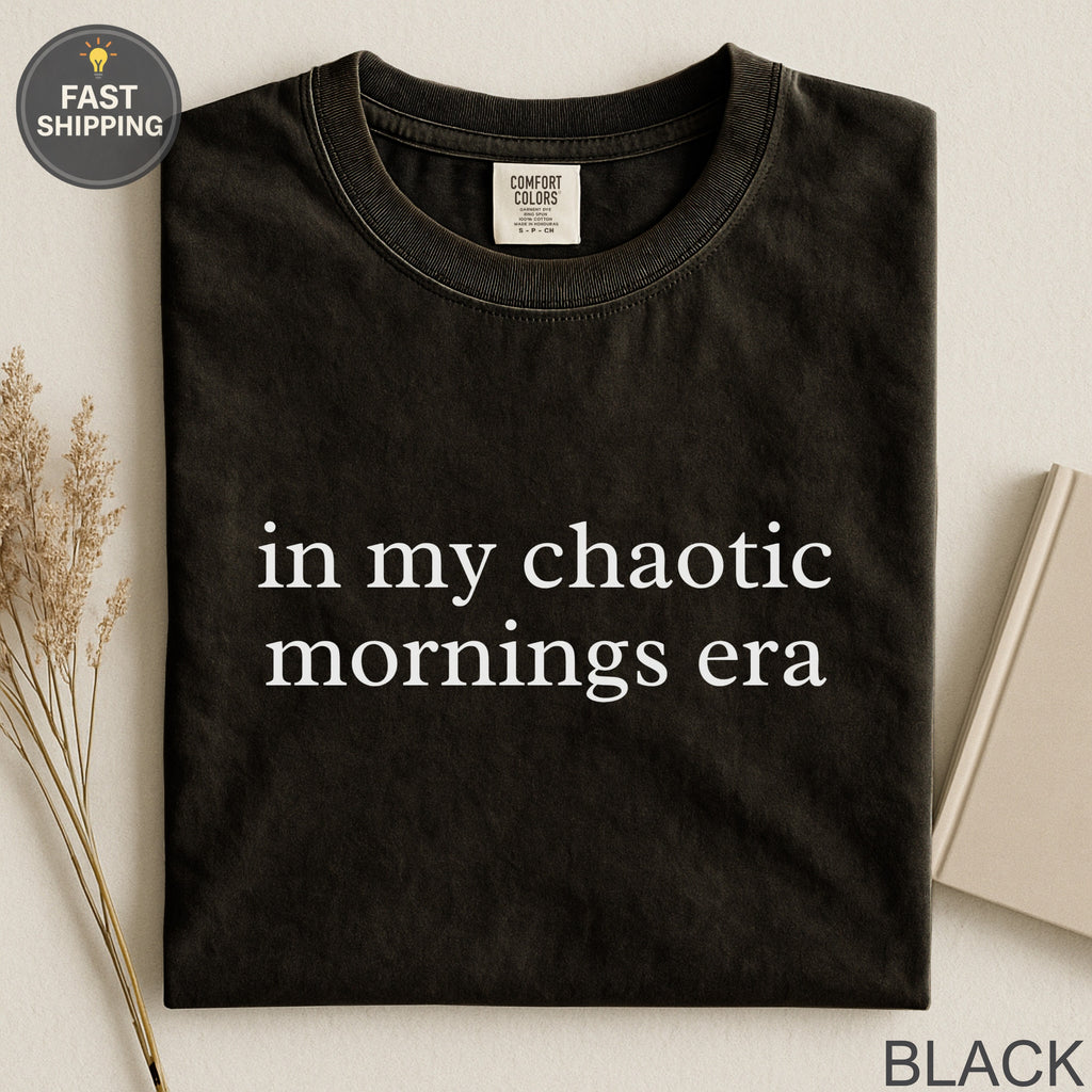 Black t-shirt with "in my chaotic mornings era" text.