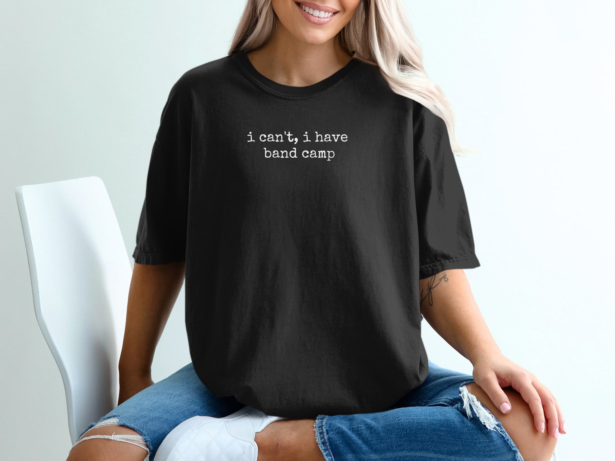 Black t-shirt with "I can't, I have band camp" text.
