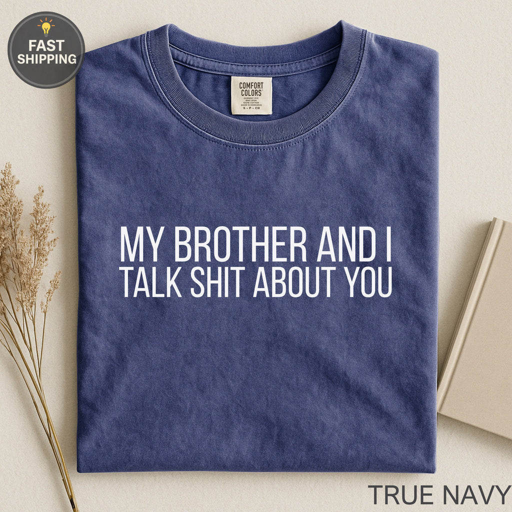 Navy t-shirt with white text "MY BROTHER AND I TALK SHIT ABOUT YOU."