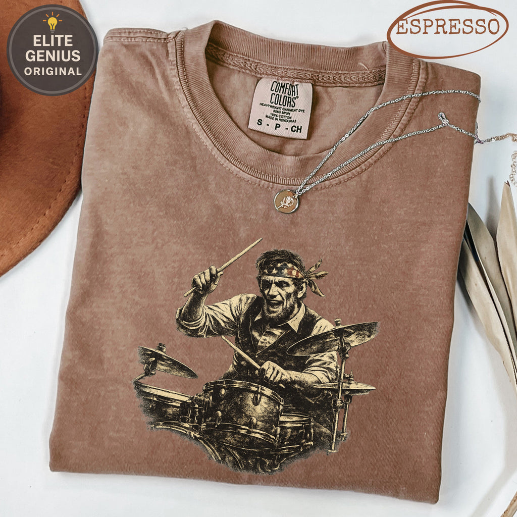 Brown t-shirt with vintage drummer graphic, "Elite Genius Original" and "Espresso" text.