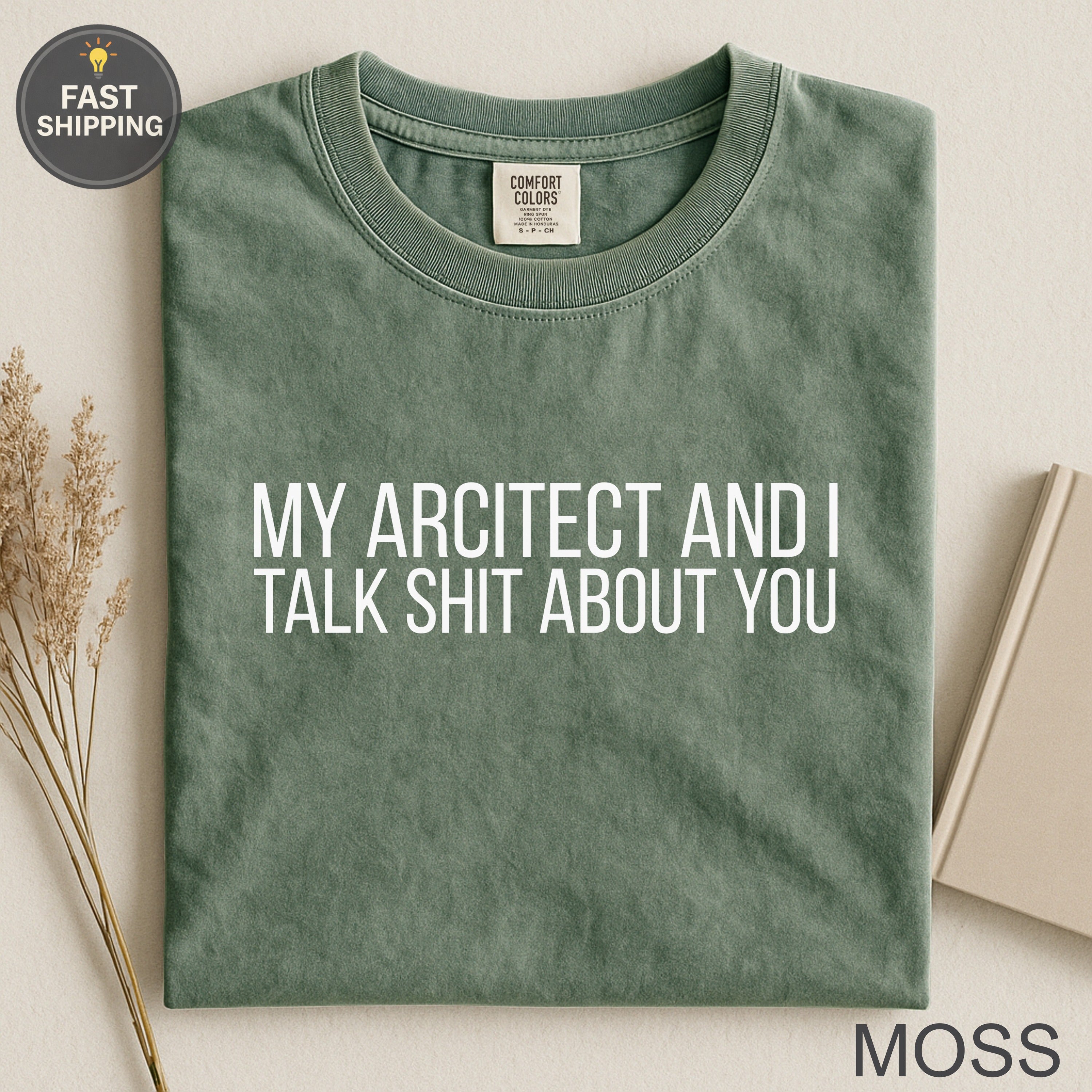 Green t-shirt with white text "MY ARCITECT AND I TALK SHIT ABOUT YOU"