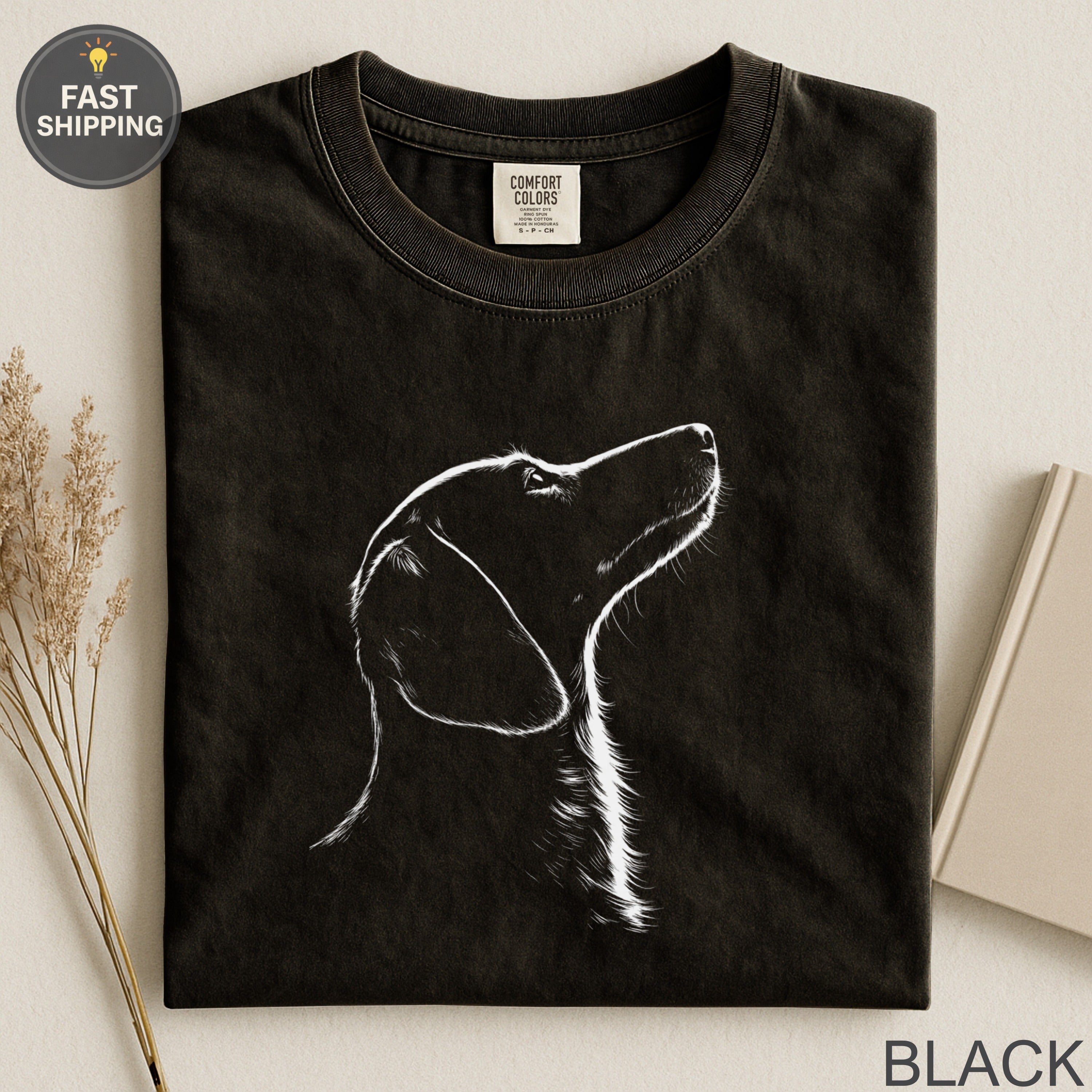 Black t-shirt with white outline sketch of a dog's profile, "Fast Shipping" visible.