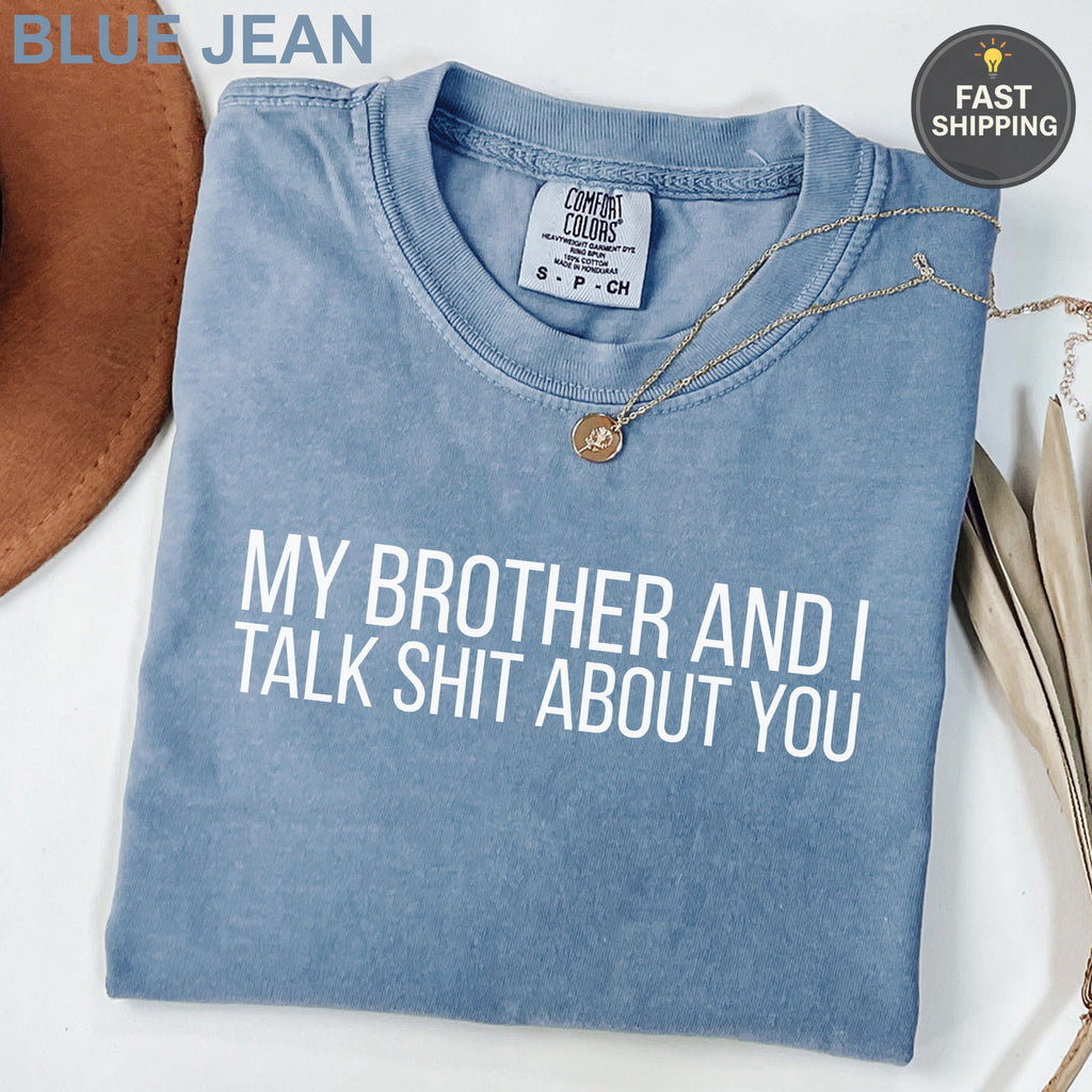 Blue t-shirt with "MY BROTHER AND I TALK SHIT ABOUT YOU" text.