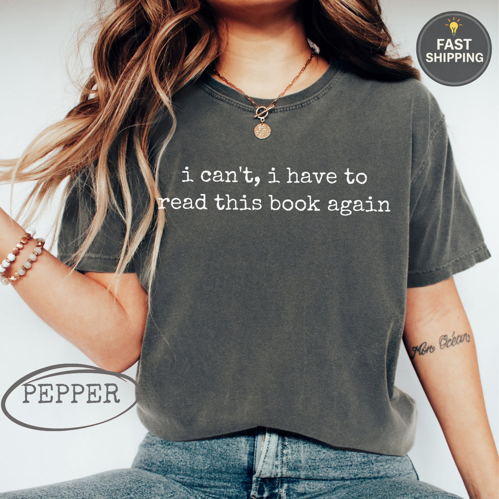 Charcoal t-shirt with "i can't, i have to read this book again" text.