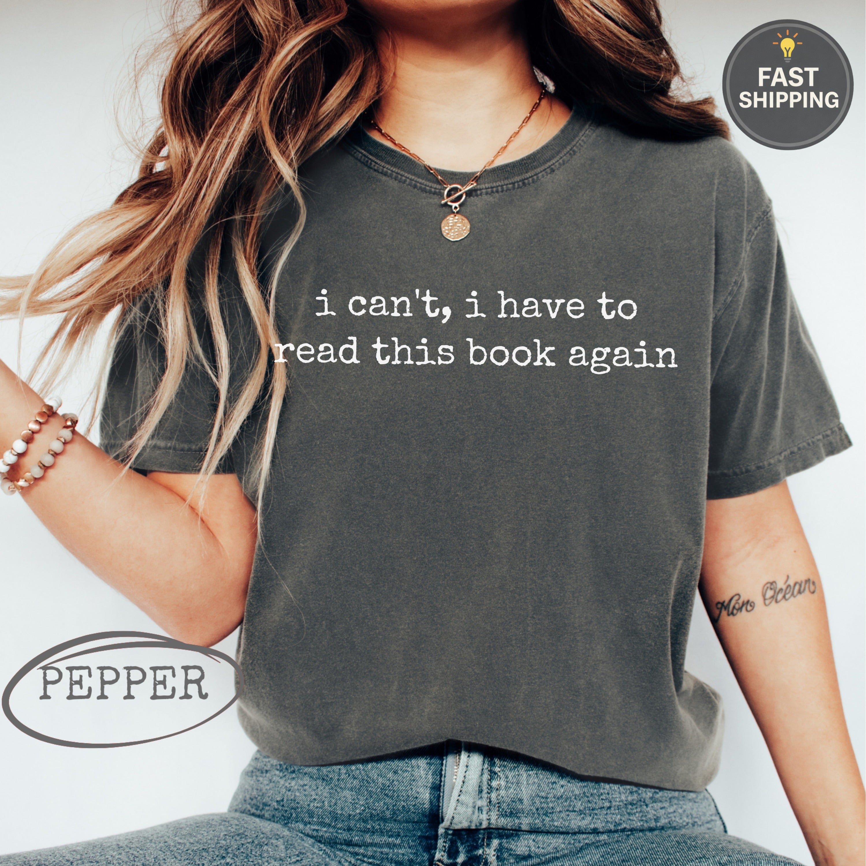 Charcoal t-shirt with "i can't, i have to read this book again" text.