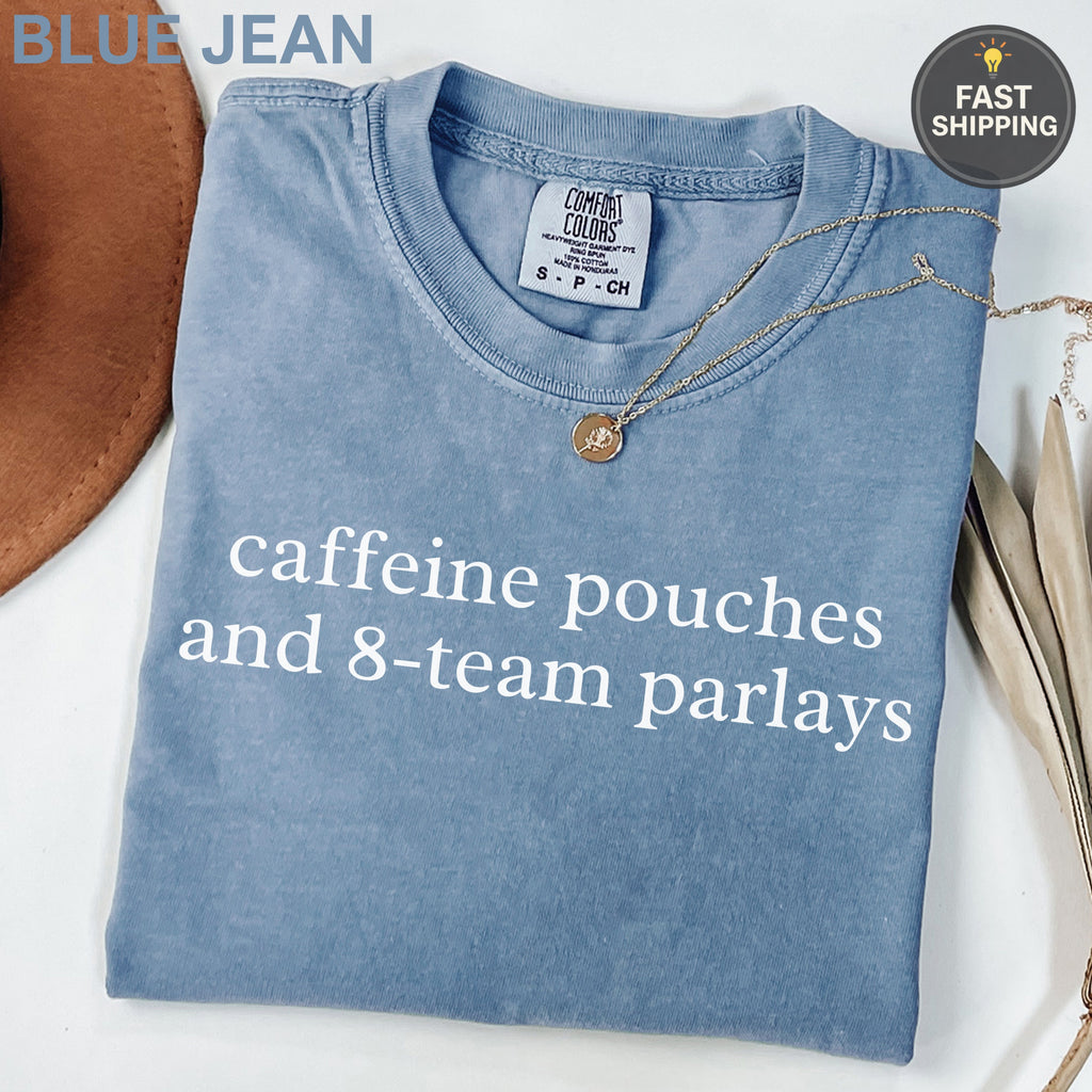 Comfort Colors blue t-shirt with "caffeine pouches and 8-team parlays" text.