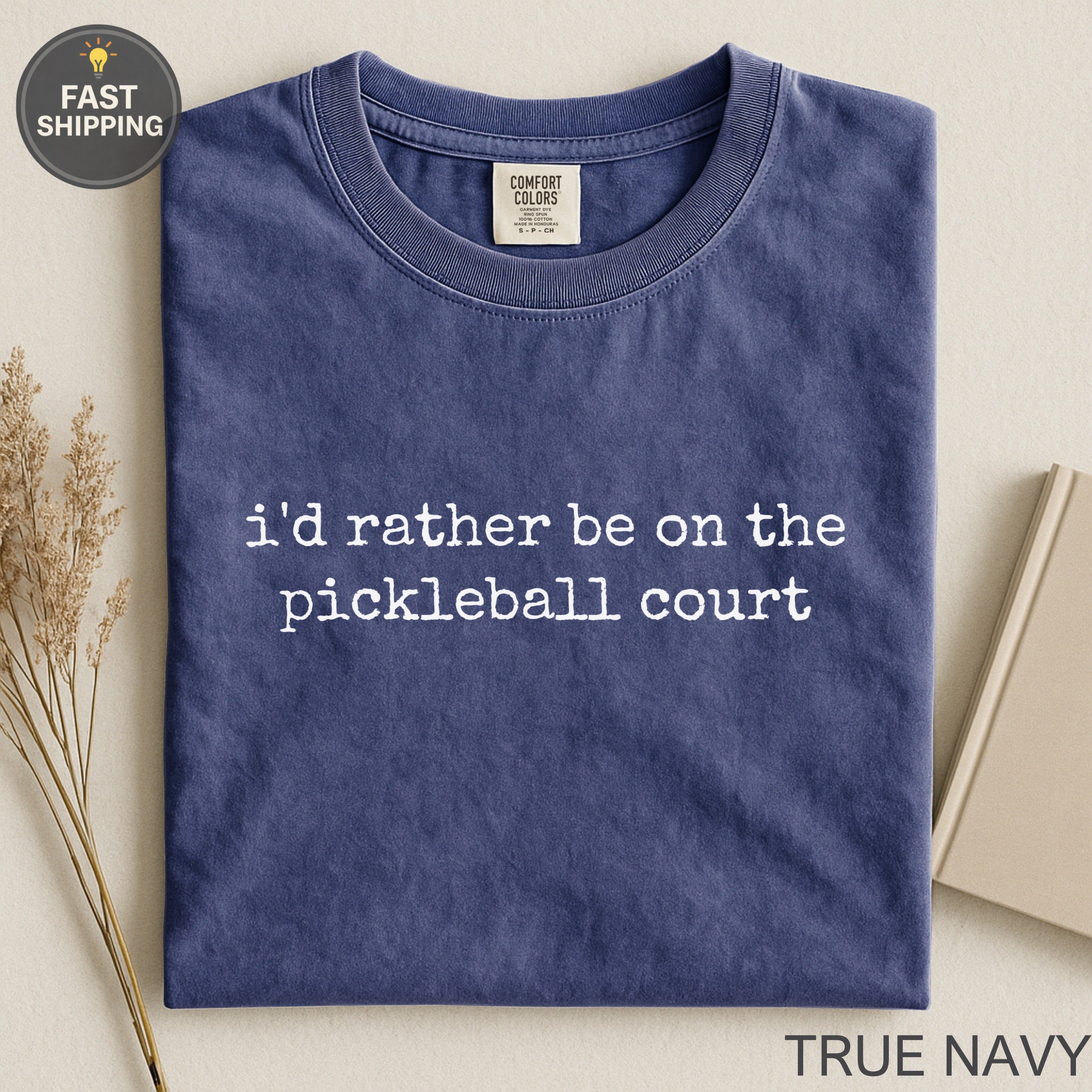 Navy blue t-shirt with "i'd rather be on the pickleball court" in white text.