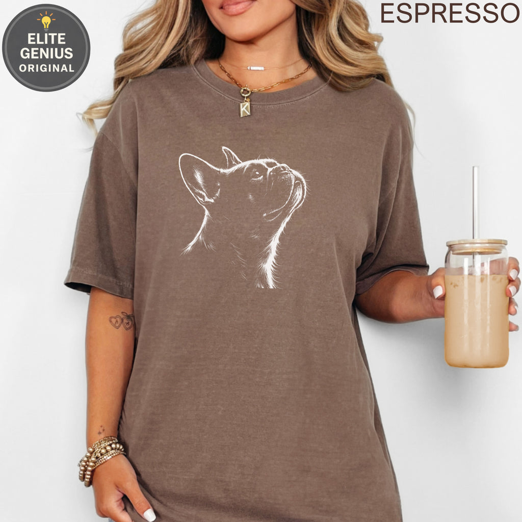 French bulldog line art on a brown t-shirt, held by a woman.