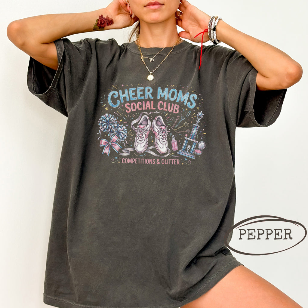 Cheer moms social club graphic tee with sneakers, trophy, and flowers.