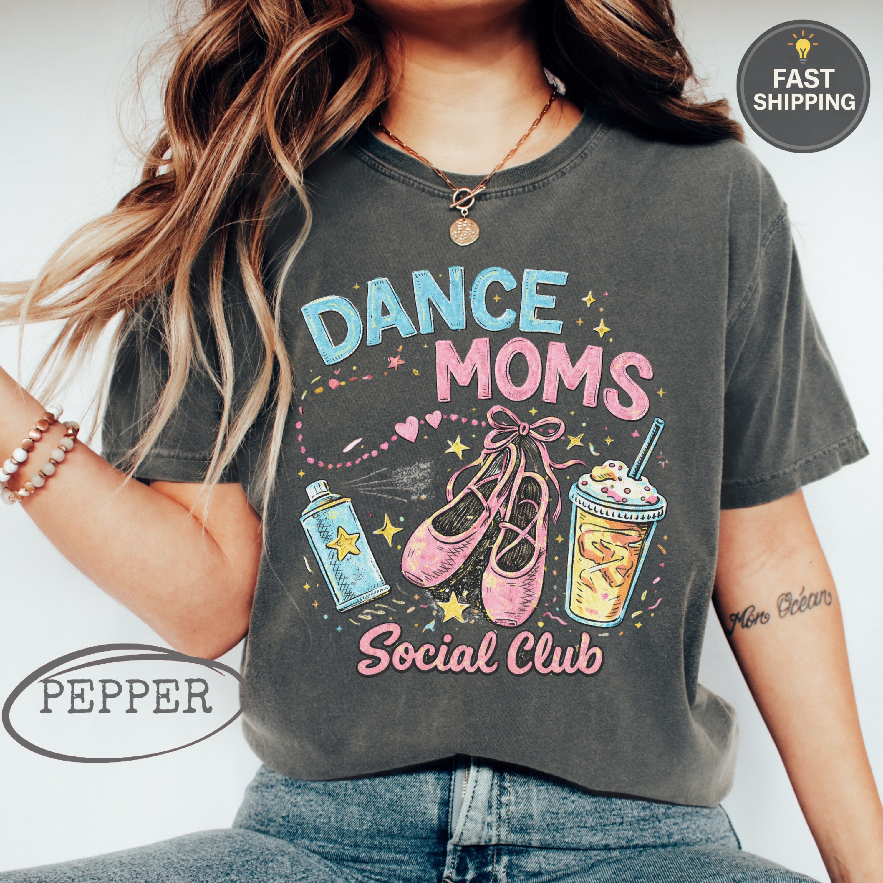 Dark gray t-shirt with "Dance Moms Social Club" text and ballet shoes.