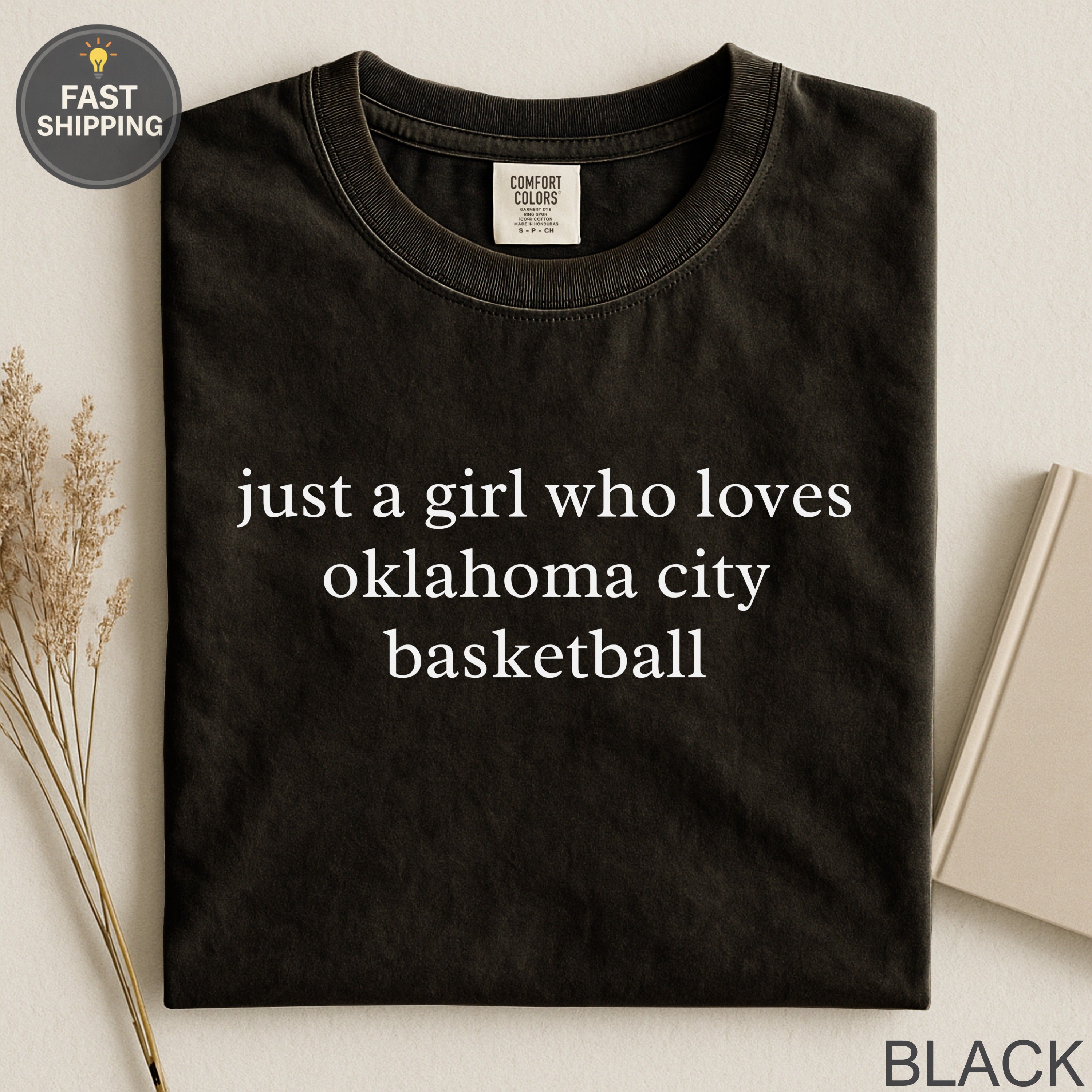 Black t-shirt with "just a girl who loves oklahoma city basketball" text.