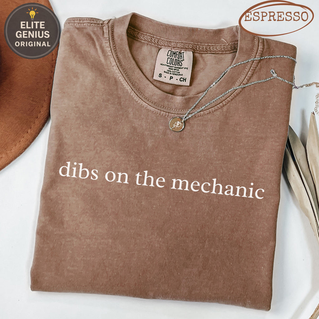 Brown Comfort Colors t-shirt with "dibs on the mechanic" text.