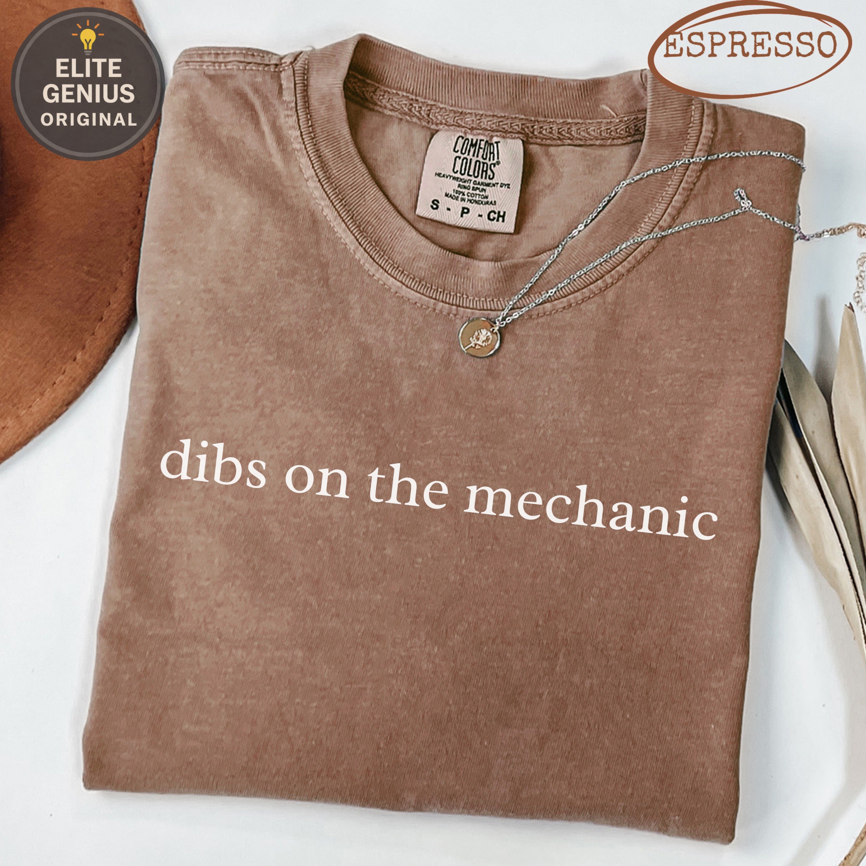 Brown Comfort Colors t-shirt with "dibs on the mechanic" text.
