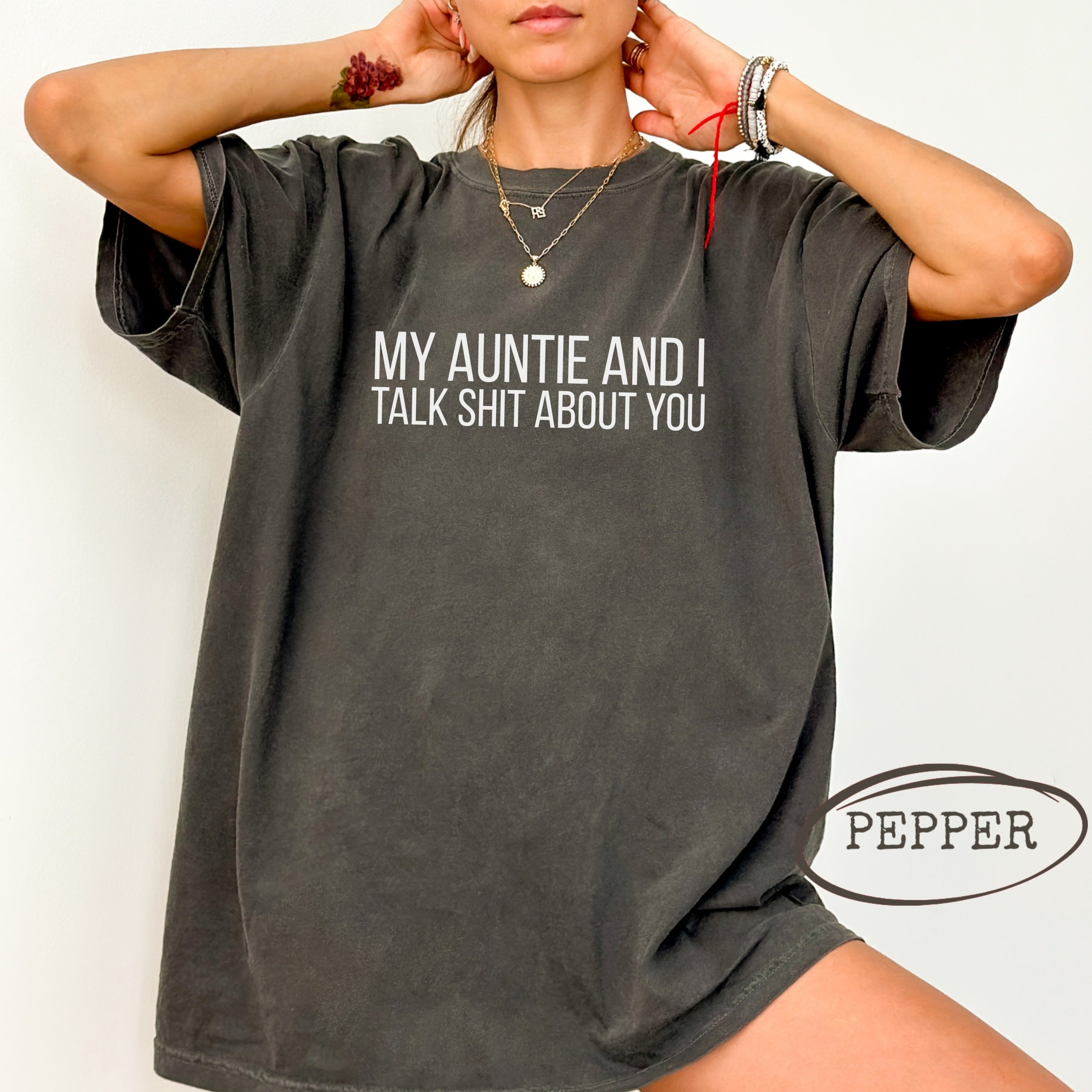 Black t-shirt with white text "MY AUNTIE AND I TALK SHIT ABOUT YOU".