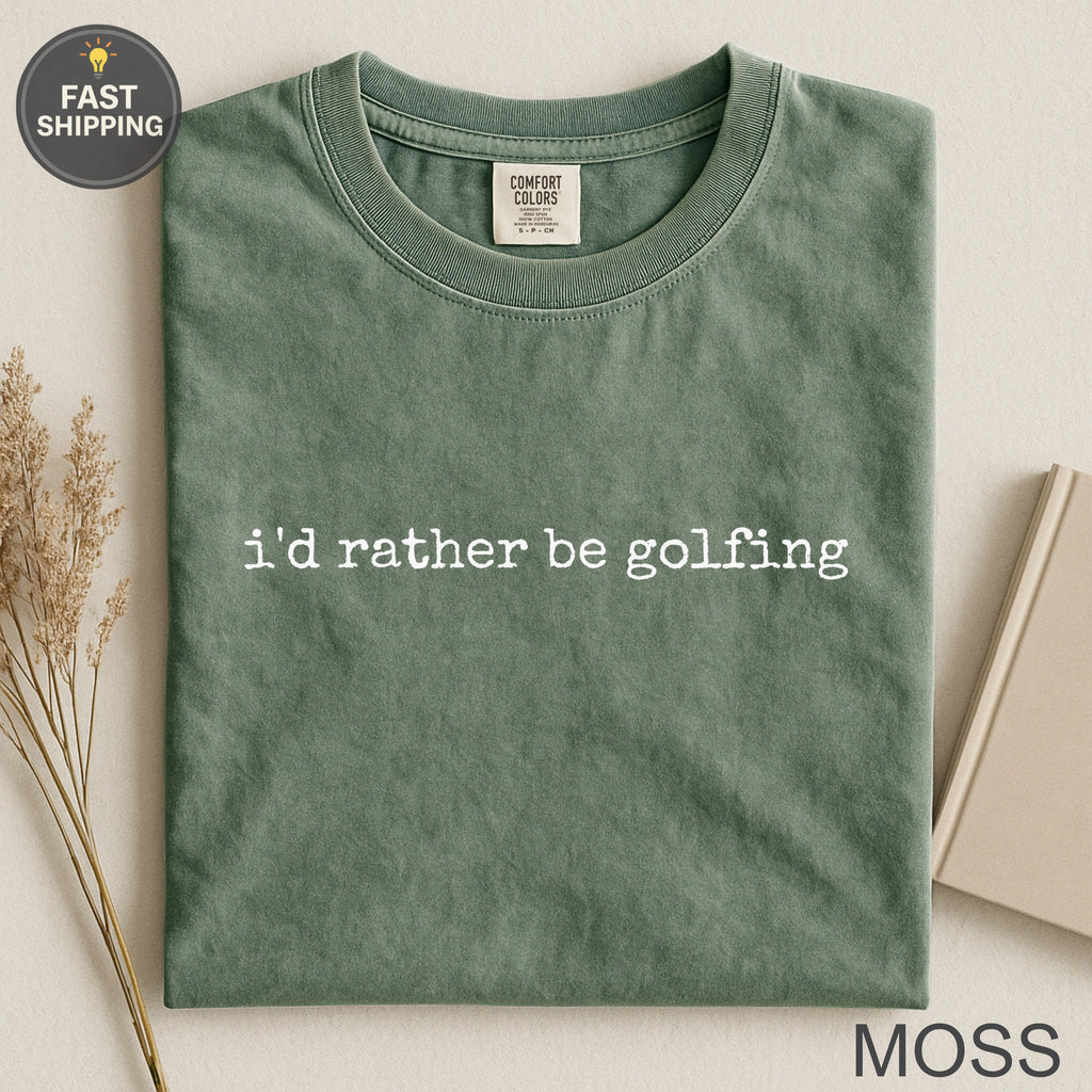 Comfort Colors moss green t-shirt with "i'd rather be golfing" text.