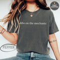 Dark grey t-shirt with "dibs on the mechanic" text and "Pepper" logo.