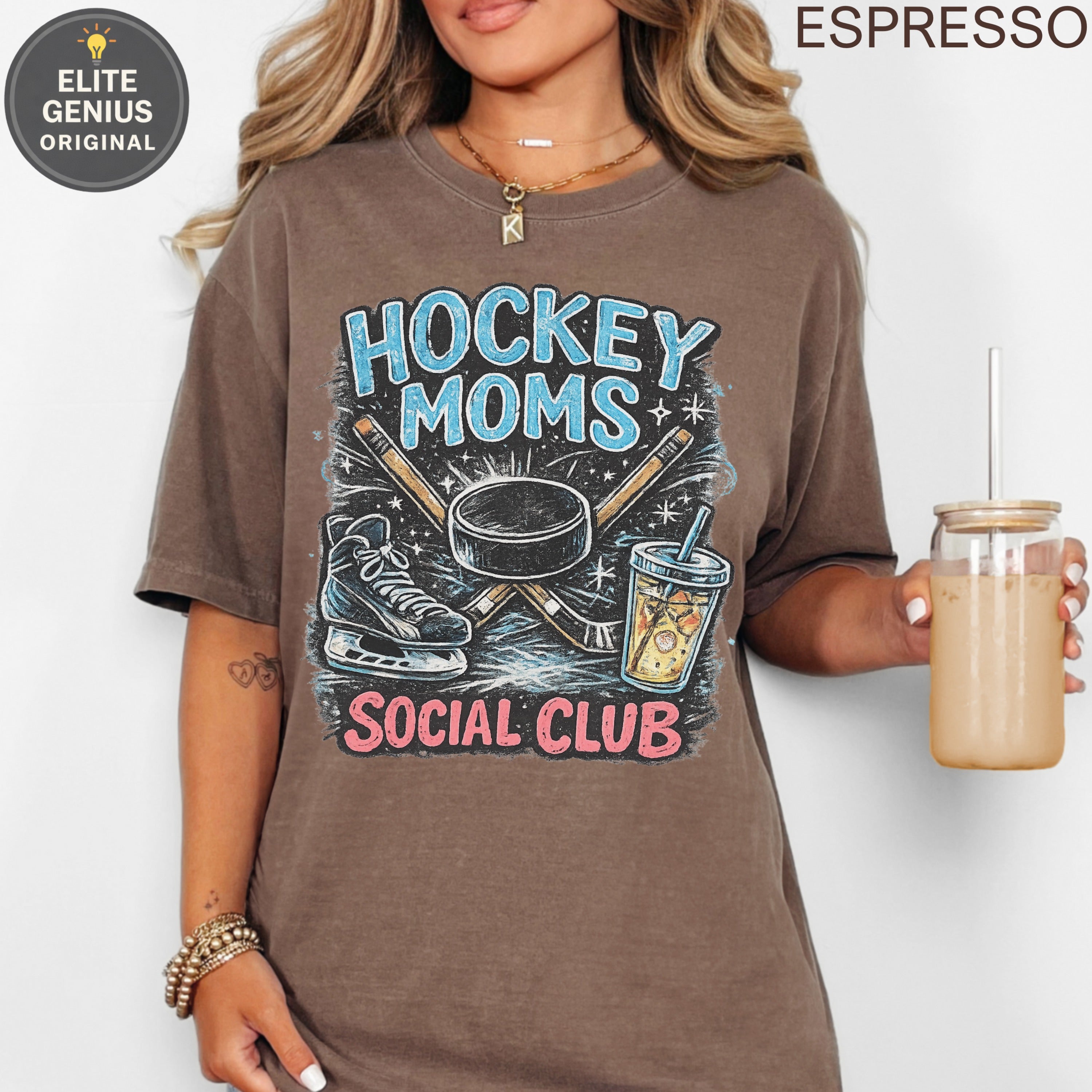 Brown t-shirt with "Hockey Moms Social Club" text, hockey sticks, skates, and drink.