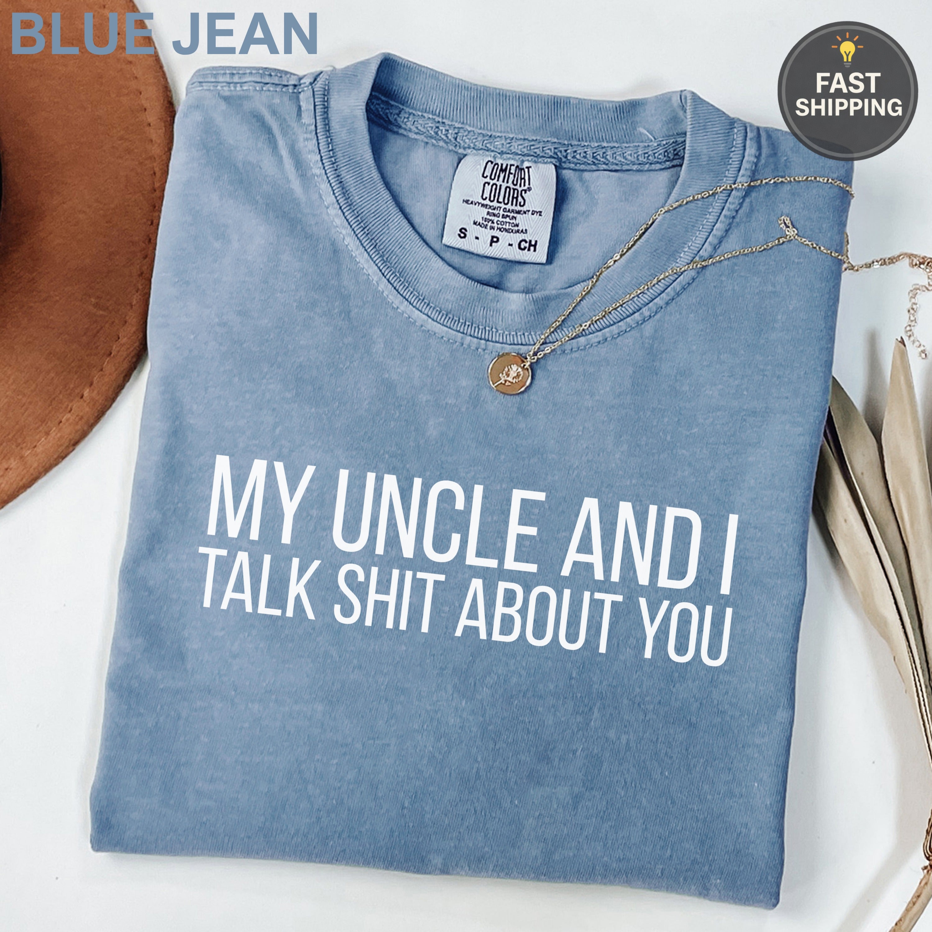 Blue Jean Comfort Colors t-shirt with "My Uncle and I Talk Shit About You" slogan.