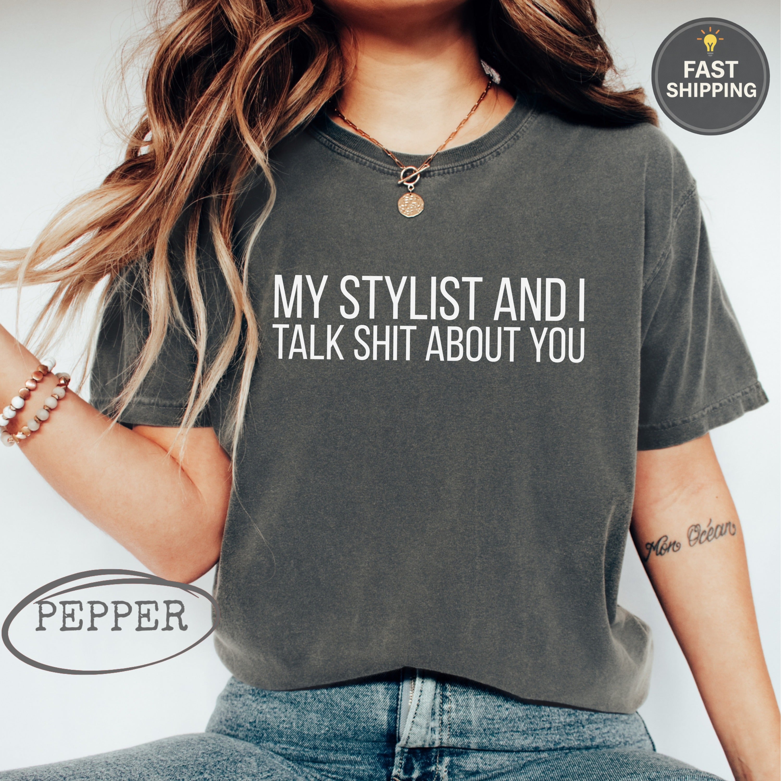 Charcoal t-shirt with white text: "MY STYLIST AND I TALK ABOUT YOU"