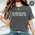 Black t-shirt with white text "MY BROTHER AND I TALK SHIT ABOUT YOU".