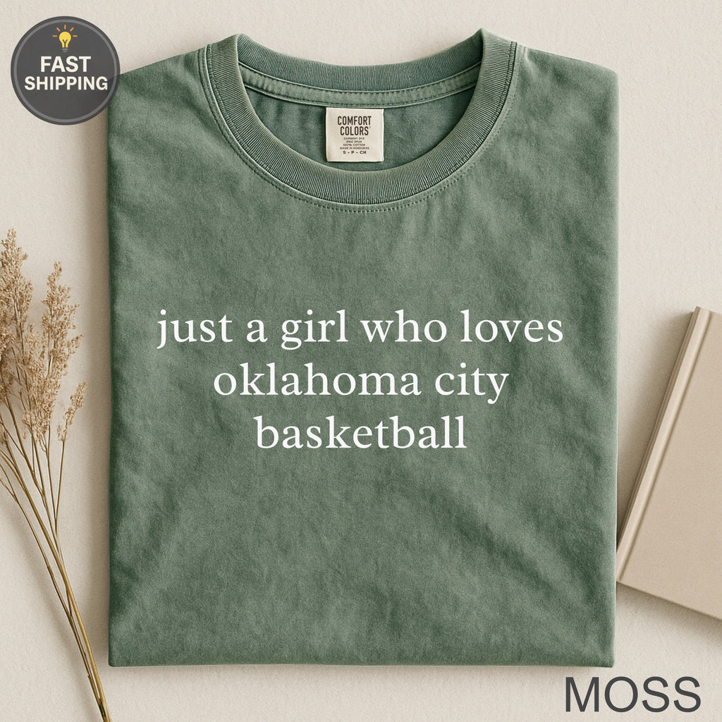 Green t-shirt with text "just a girl who loves oklahoma city basketball".