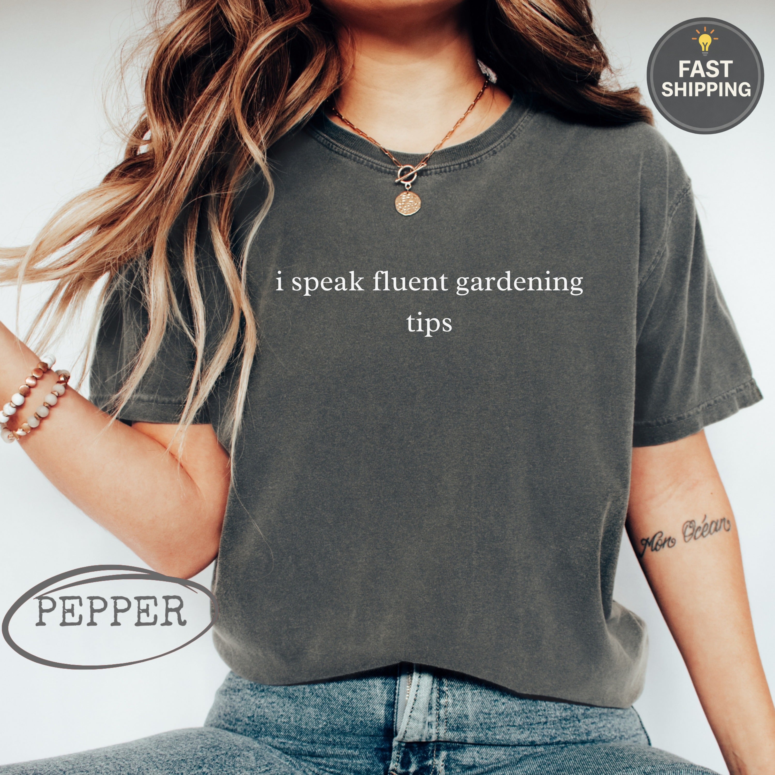 Dark gray t-shirt with "i speak fluent gardening tips" text.