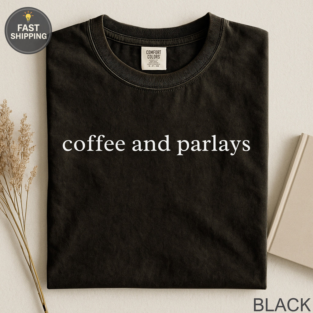 Black t-shirt with white text "coffee and parlays" and "FAST SHIPPING" tag.