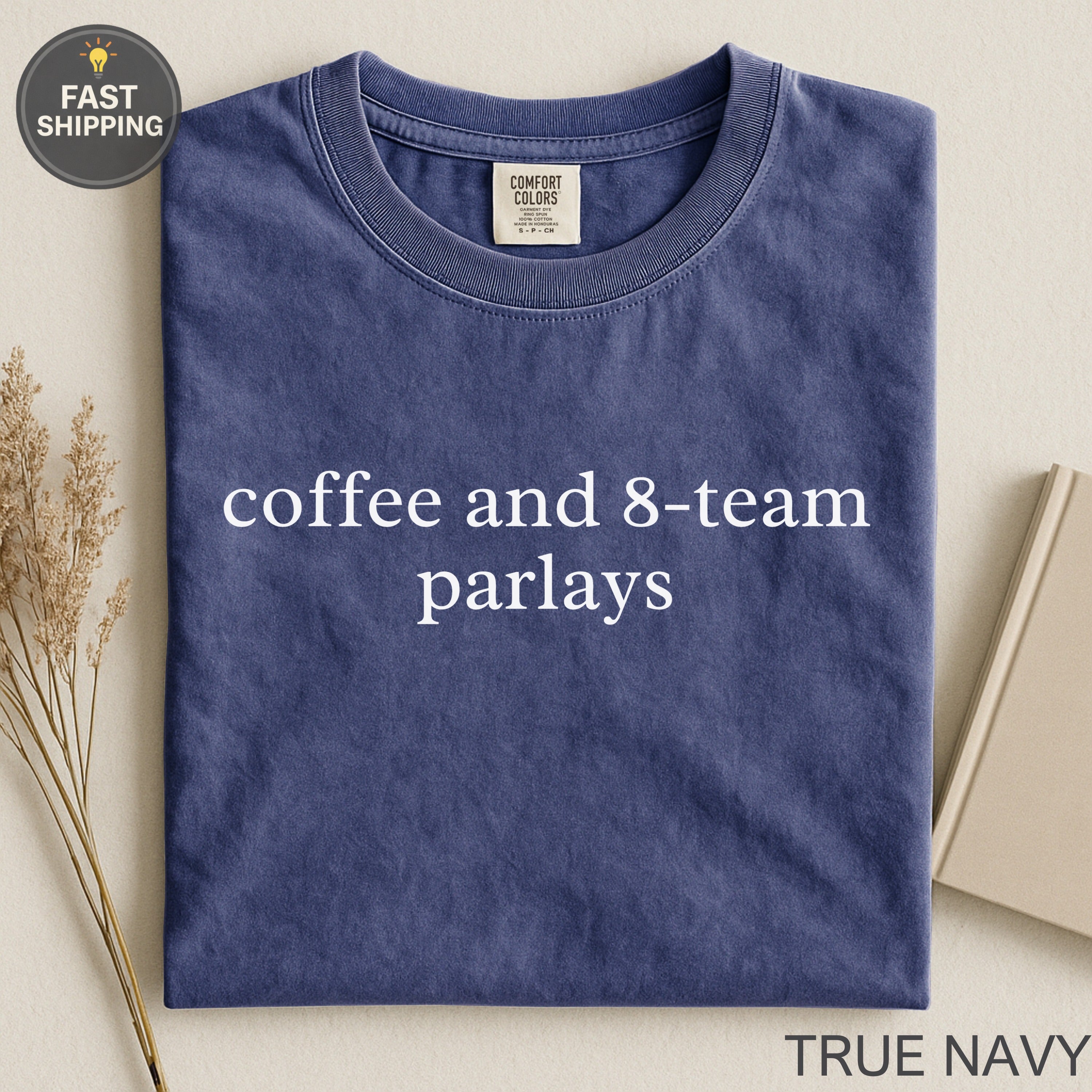 Navy t-shirt with "coffee and 8-team parlays" text.