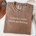 Brown t-shirt with "i can't, i have choas gardening" printed in white.