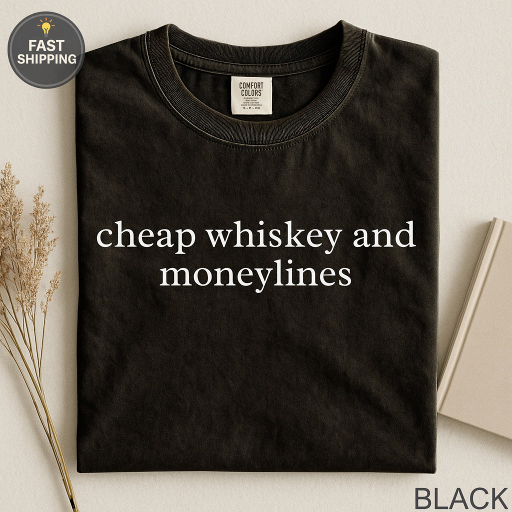 Black t-shirt with "cheap whiskey and moneylines" text.