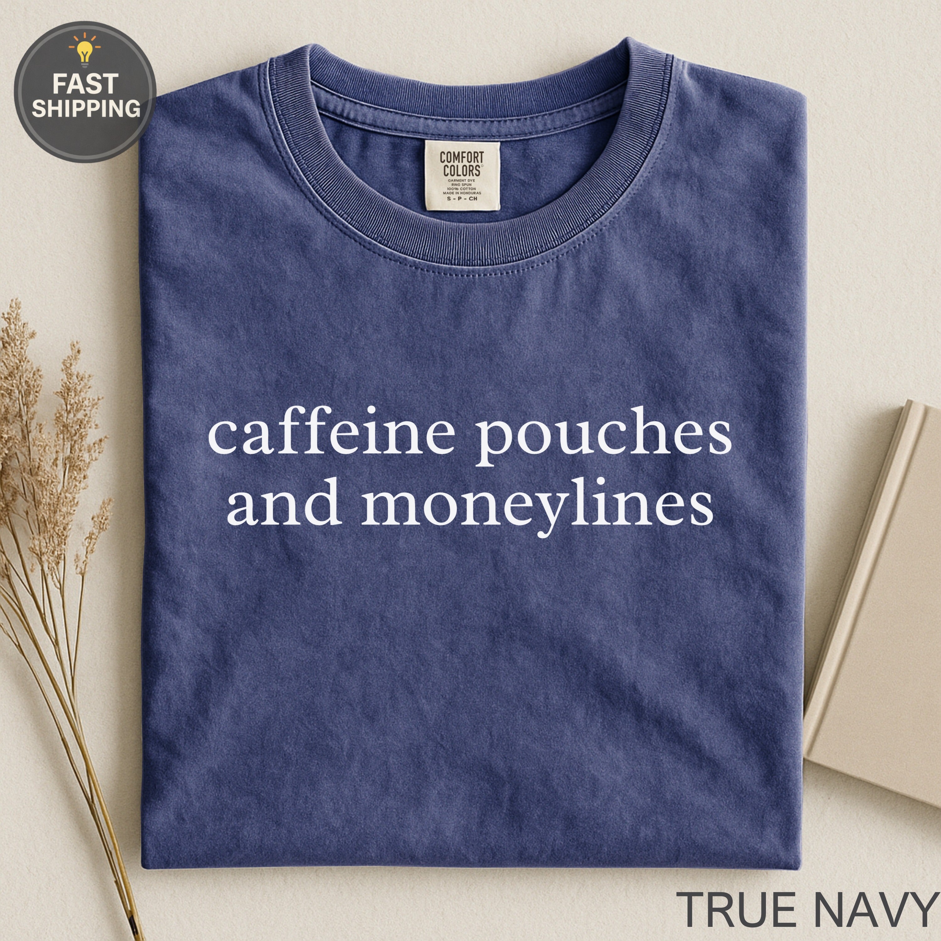 Navy Comfort Colors t-shirt with "caffeine pouches and moneylines" text.