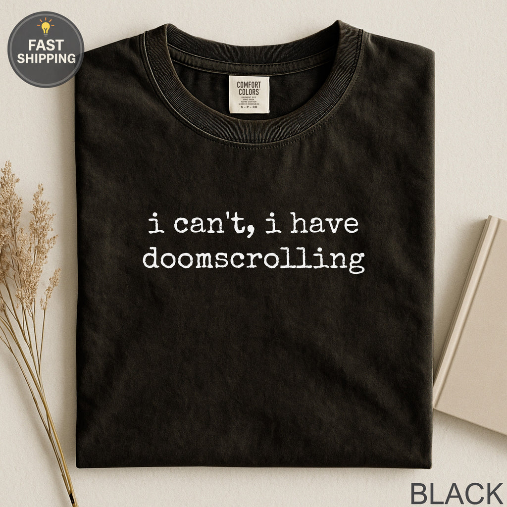Black Comfort Colors t-shirt with "i can't, i have doomscrolling" text.