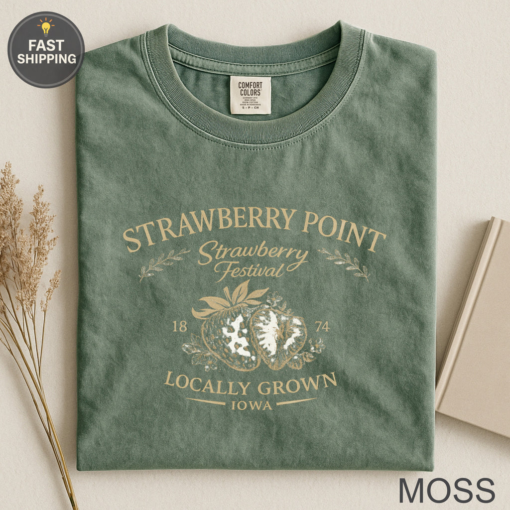 Green t-shirt for Strawberry Point Festival with strawberries and "18 74 Locally Grown Iowa" text.